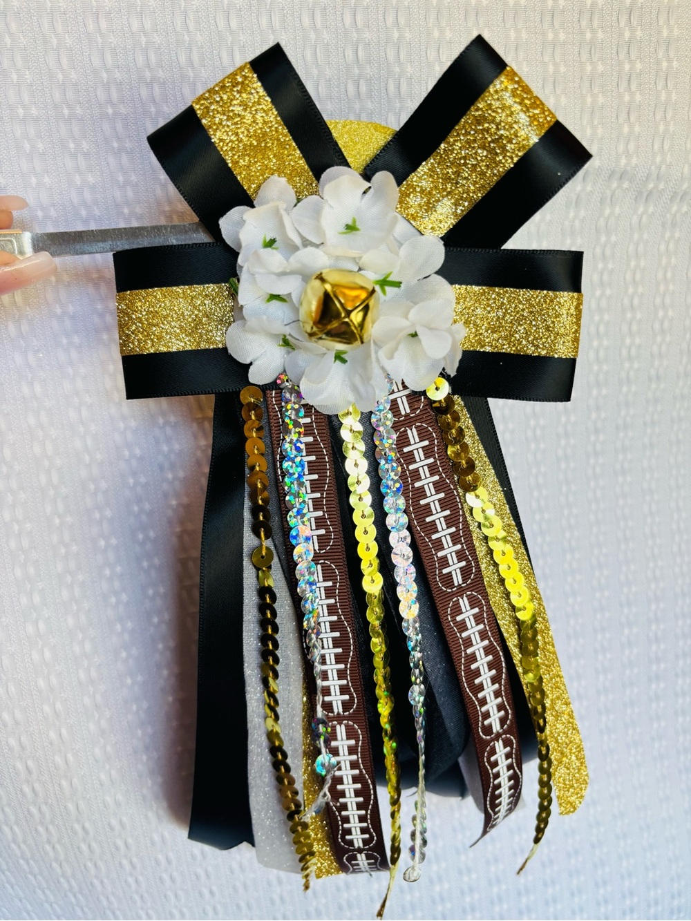 Gold & Black Ribbon Boutonniere with White Flower and Bell